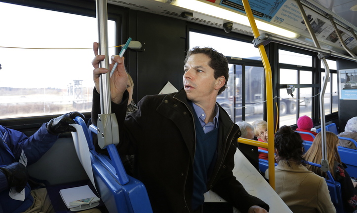 Maine Senate President Justin Alfond rode bus No. 5 on Portland's Metro system Tuesday along with other politicians and protesters to see how long the bus ride would be from Portland to the proposed site of the DHHS offices in South Portland.