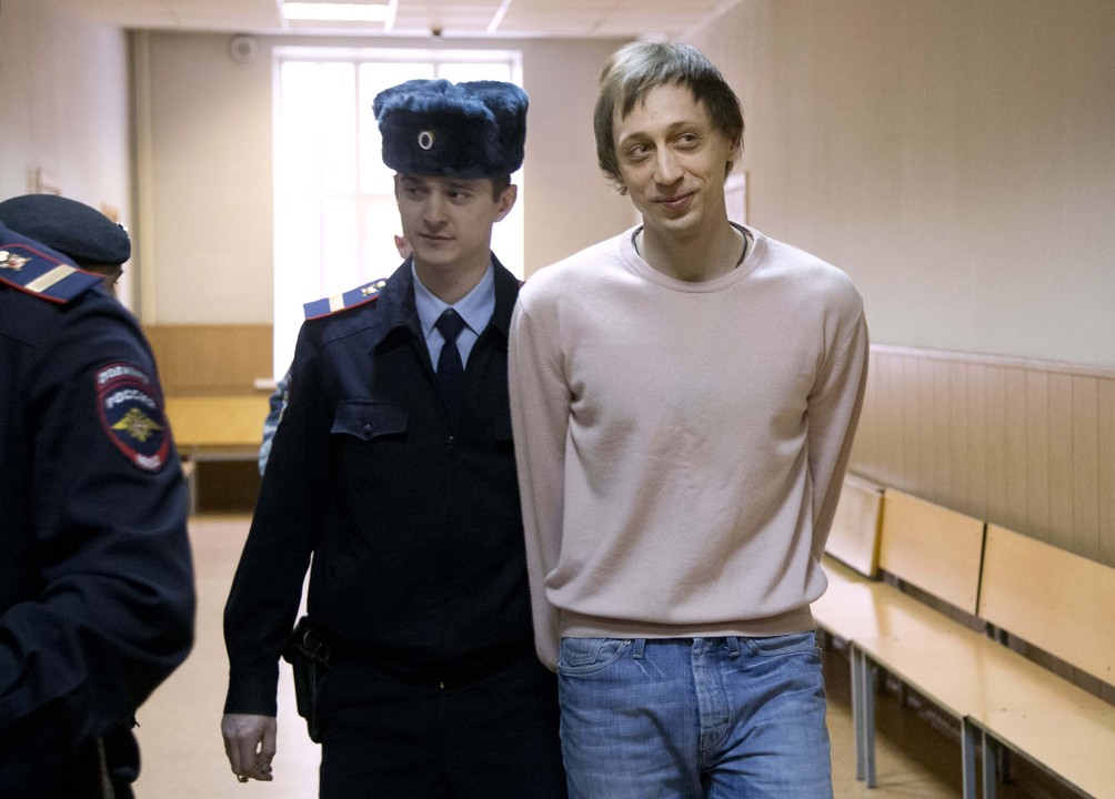Pavel Dmitrichenko is escorted to a courtroom in Moscow Tuesday. The dancer was convicted of planning the Jan. 17 acid attack on the Bolshoi ballet’s artistic director Sergei Filin.