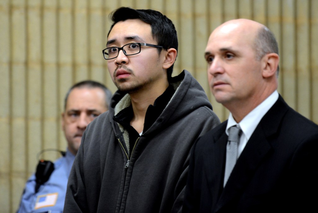 University of New Haven student William Dong, 22, of Fairfield, Conn., with assistant public defender Kevin Williams, right, appears during his arraingment Wednesday, Dec. 4, 2013, at Superior Court in Milford, Conn. Dong, 22, was charged with illegal possession of an assault weapon and other crimes after Tuesday’s scare, which led to a a University of New Haven campus lockdown of more than four hours. Police say they don’t know why Dong brought guns to the campus.