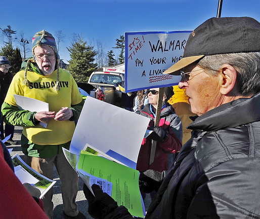The Southern Maine Labor Council's John Newton, left, hands out literature to protesters on Black Friday last week at the Walmart in Scarborough. A letter writer praises Newton for his efforts to help volunteers plant new ideas in people’s minds.