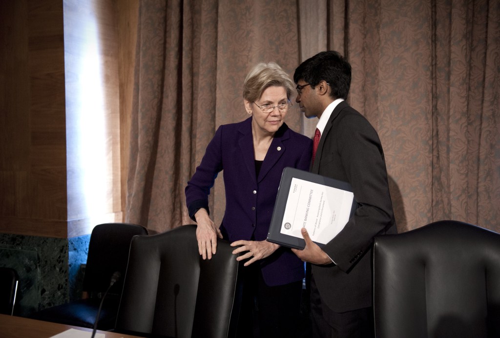 U.S. Sen. Elizabeth Warren, D-Mass., confers with Ganesh Sitarama, her senior counsel, after attending a Senate Banking Committee hearing on anti-money laundering in March. She said Wednesday that she will not run for president in 2016.