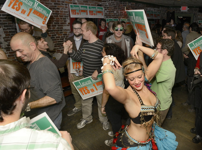 Belly dancer Whitley “Nabintu” Marshall dances as proponents of Portland’s Yes on One celebrate at Brian Boru in Portland on Nov. 5. Police, city officials and proponents of legalization want to clarify the ordinance.