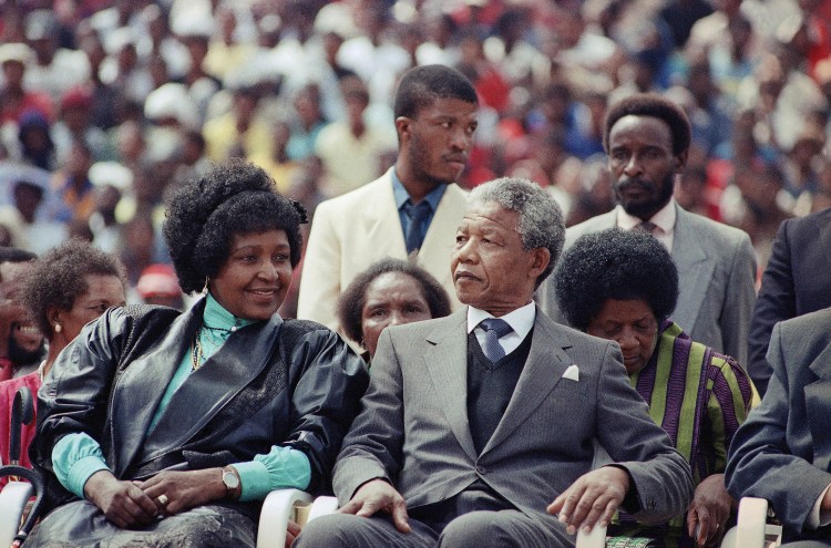 In this Feb. 13, 1990, photo, Nelson Mandela, and then-wife, Winnie, participate in a South African Communist Party Rally in Soweto, South Africa, shortly after Mandela's release from 27 years in prison. 