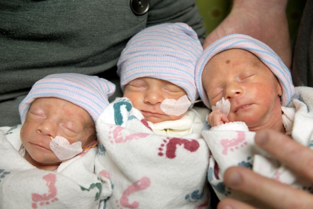 Hannah and Tom Hepner of Quincy, Calif., parents of identical triplets, hold, from left, Abby, Laurel and Brindabella in a self-care room at Sutter Memorial Hospital on Wednesday in Sacramento, Calif. The triplets were born on Nov. 22, 2013.