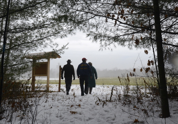 Protecting, appreciating and enjoying the landscape are the goals shared by proponents of the Hills to Sea Trail, including Buck O’Herin (left), a board member of the Sheepscot Wellspring Land Alliance, as he leads a couple hikers past the trail head kiosk in Unity.