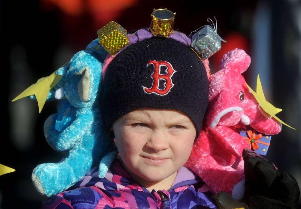 Madissynn Sutton, 7, wears a pair of stuffed elephant earmuffs at the annual Chester Greenwood Day parade in downtown Farmington on Saturday.