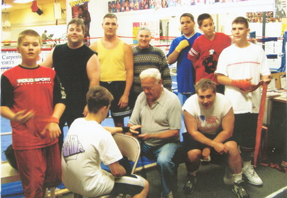 Richard Potvin with some of the young men he worked with at the Southern Maine Boxing Club.