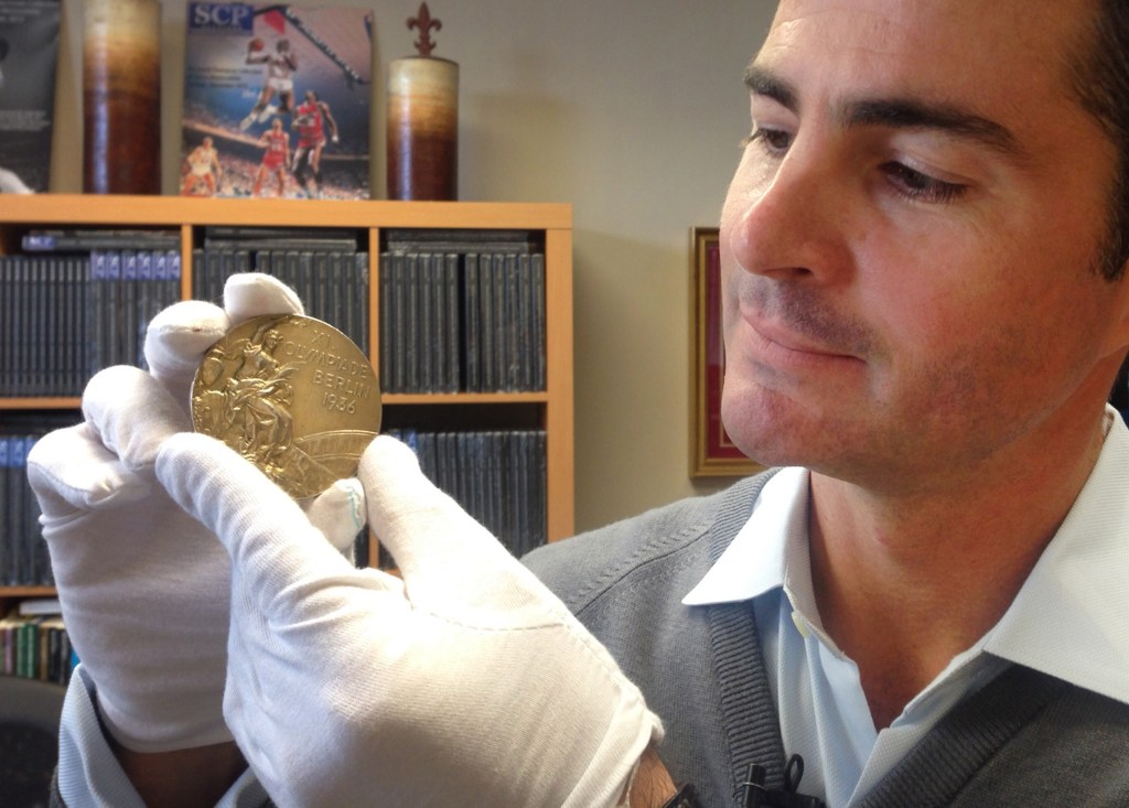 Dan Imler of SCP Auctions shows Jessie Owens gold medal from the 1936 Olympics at the SCP Auctions in Laguna Nigel, Calif. One of the four Olympic gold medals won by track and field star Jesse Owens at the 1936 Berlin Games. It sold for a record $1,466,574.
