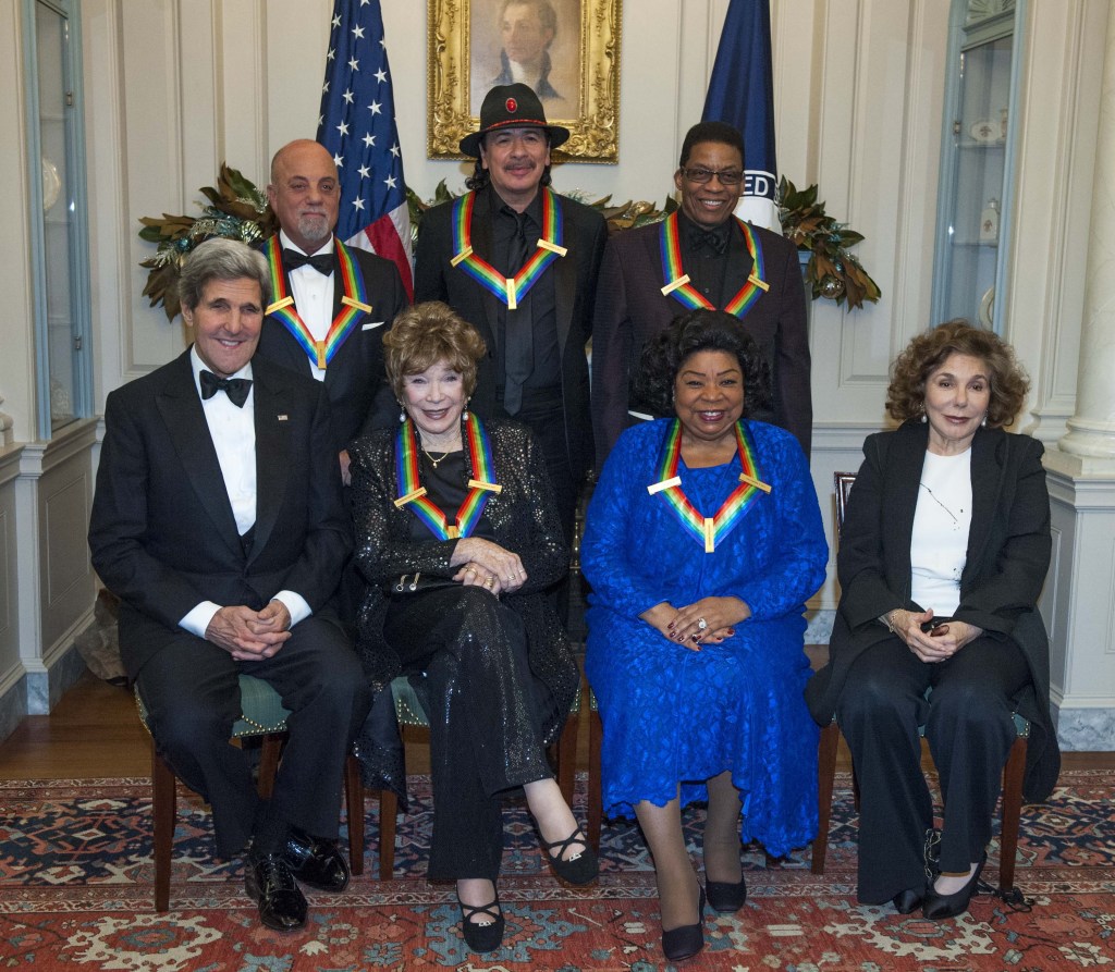 Secretary of State John Kerry, with the 2013 Kennedy Center honorees, from left, seated Shirley MacLaine and Martina Arroyo, along with Teresa Heinz Kerry. Standing are Billy Joel, Carlos Santana, and Herbie Hancock. The Kennedy Center Honors gala dinner was held Saturday in Washington.