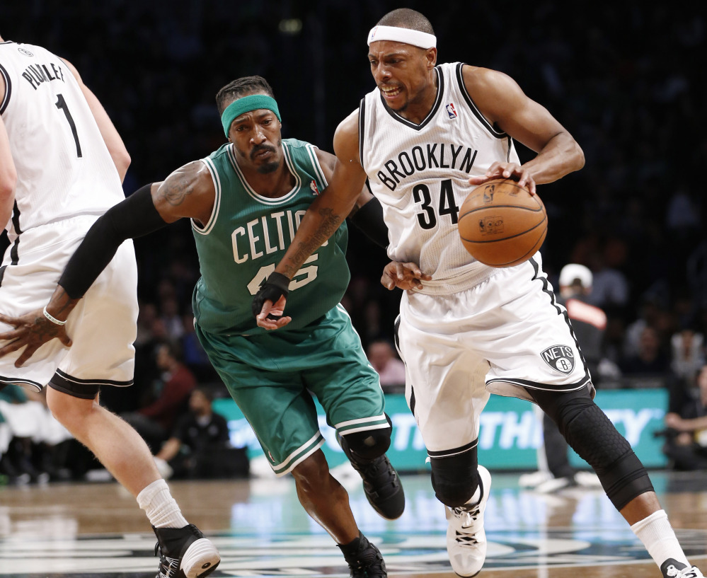 Paul Pierce looked a whole lot different Tuesday night, wearing a Brooklyn Nets uniform, coming off the bench and finishing with four points. But Brooklyn did beat the Celtics.