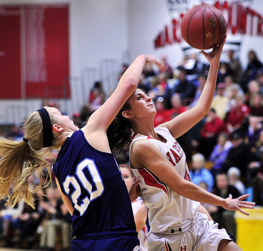 York's Chloe Smedley tries to block a layup by Wells' Syndney LaChapelle. Tuesday, December 10, 2013. Gordon Chibroski/Staff Photographer 281371