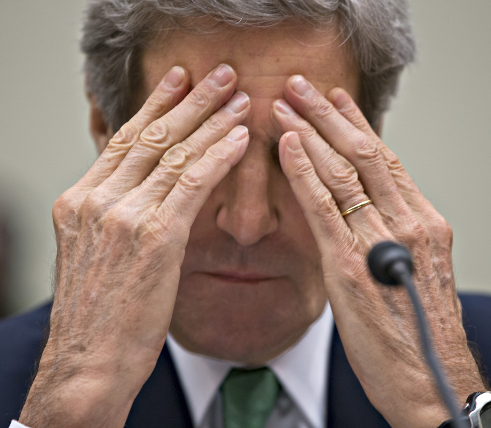 Secretary of State John Kerry pauses while testifying Tuesday before the House Foreign Affairs Committee.