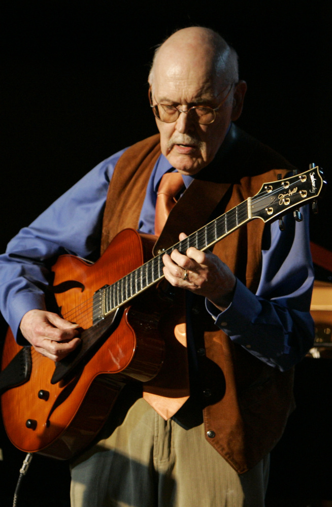 Guitarist Jim Hall, shown playing at the 50th annual Monterey Jazz Festival in California, was one of the leading jazz guitarists of the modern era.