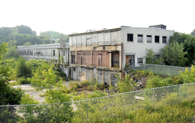 The boarded-up Keddy Mill on Depot Street in Windham occupies the site where an estimated 55,000 tons of material contaminated with PCBs are buried.
