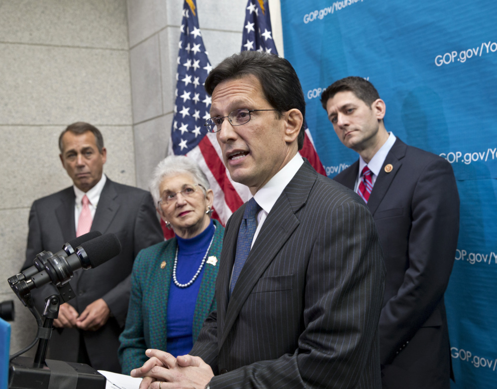 House Majority Leader Eric Cantor of Virginia speaks to reporters about the budget deal Wednesday on Capitol Hill in Washington. With him, from left, are House Speaker John Boehner of Ohio, Rep. Virginia Foxx, R-N.C., and House Budget Committee Chairman Rep. Paul Ryan, R-Wis.
