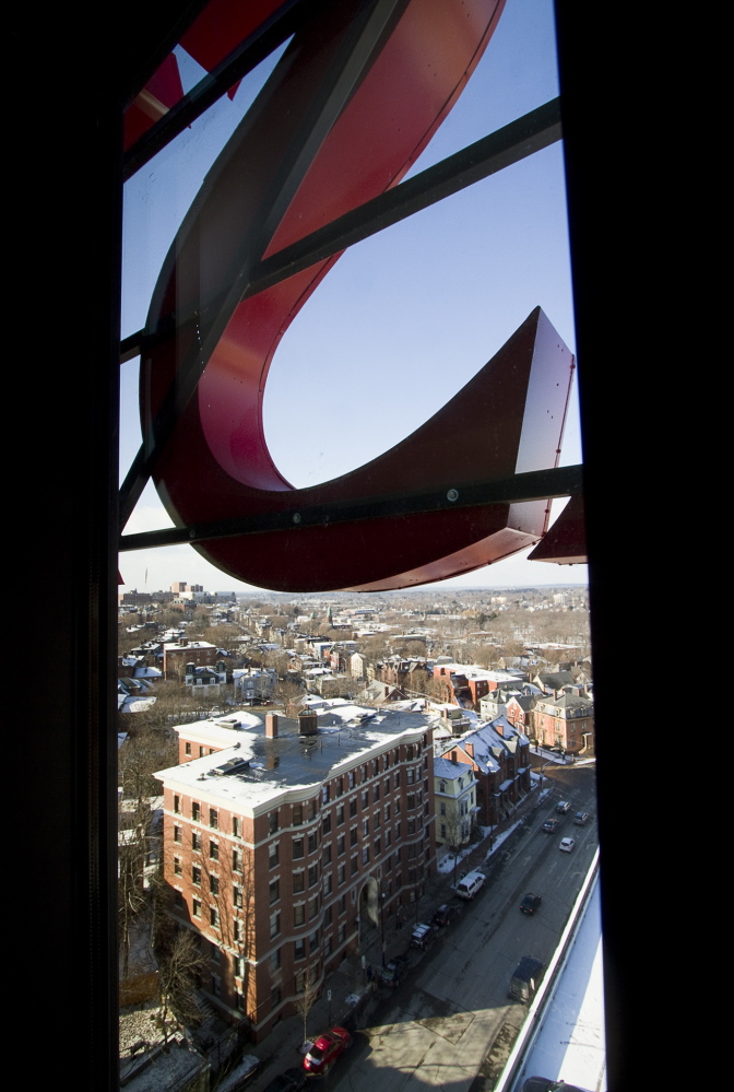 The “S” of the old Eastland Hotel sign is visible out the window of the 15th-floor Presidential Suite of the Westin Portland Harborview Hotel. The hotel is keeping the iconic Eastland sign along its roofline as a nod to its past.
