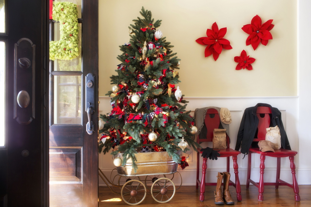 A vintage wagon serves as a mobile tree stand, so this piece of holiday decor can be moved to any room where guests are congregating.