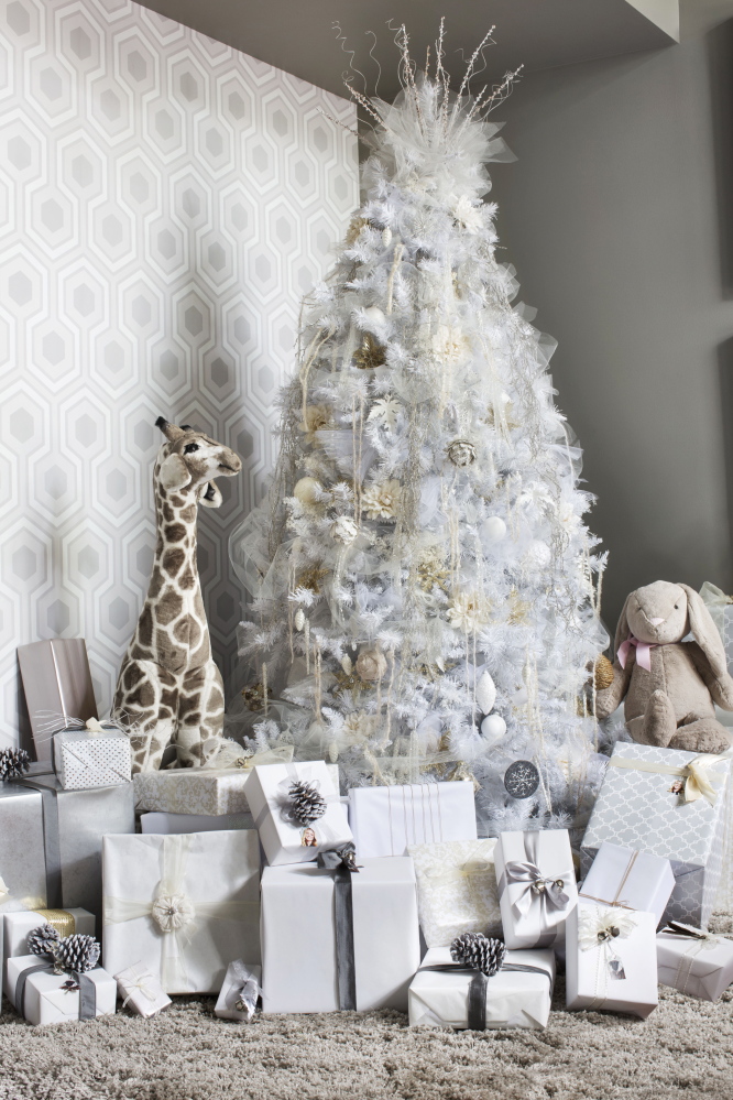 For a creative twist on a traditional Christmas tree, designer Brian Patrick Flynn uses a muted color palette of white, cream, gray and tan for a fresh look that’s understated and elegant.