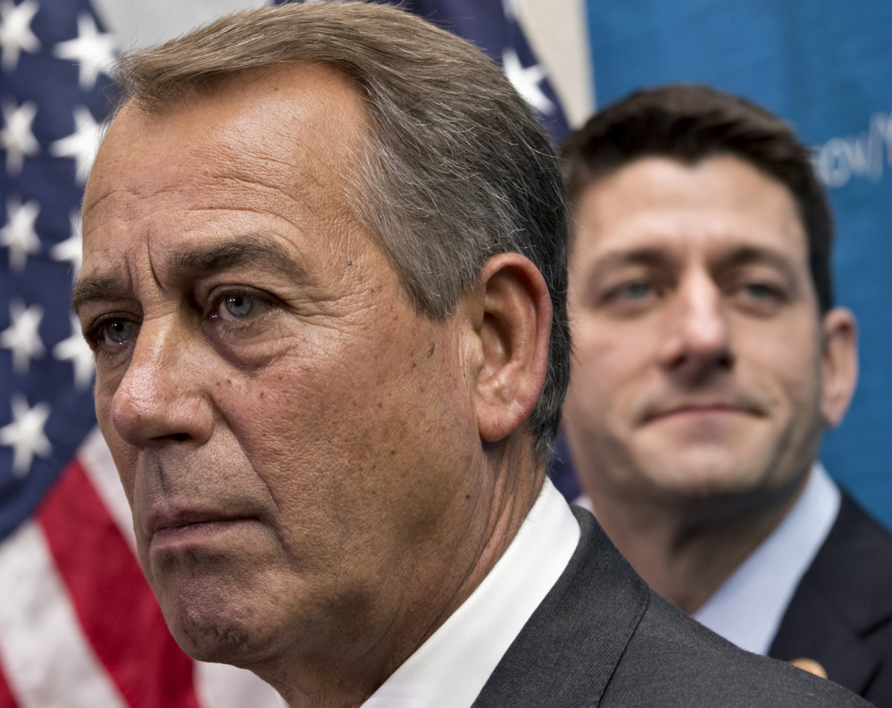 House Speaker John Boehner of Ohio, left, is flanked by House Budget Committee Chairman Rep. Paul Ryan, R-Wis., who with Senate Budget Committee Chair Rep. Patty Murray, D-Wash., worked out a budget deal. That deal leaves out extension of certain tax credits, which will now expire Dec. 31.