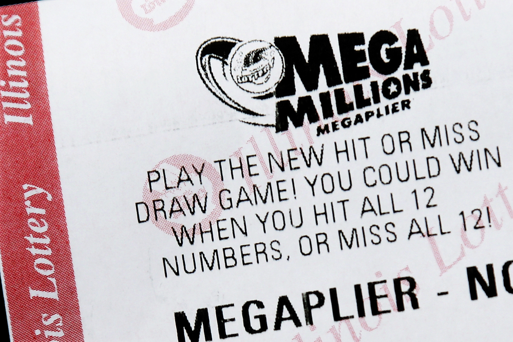 A Mega Millions lottery ticket is displayed on Friday, in Springfield, Ill. Superstition didn’t deter players hoping that Friday the 13th would bring them good luck, but officials say there is no winning ticket for the $425 million jackpot.