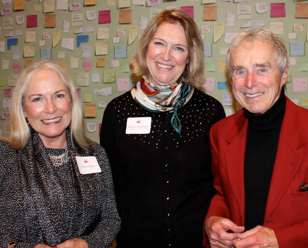 Sharon Reilly of Portland with Mary Jo Kolkhorst, a member of the Director’s Circle steering committee, and playwright Frank Reilly at the Holiday Open House.