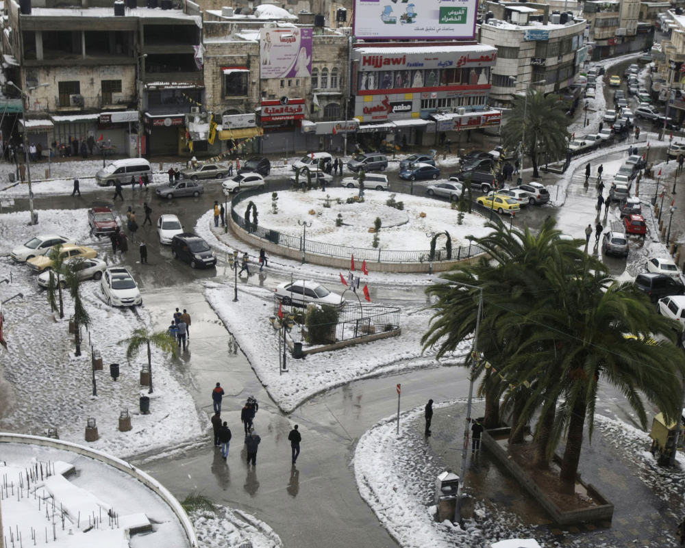 Snow starts to collect in an area of the West Bank town of Nablus on Saturday. Four days of heavy rain forced evacuation of thousands in the Gaza Strip. Jerusalem, meanwhile, was brought to its knees by a foot of snow.