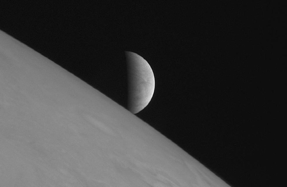 New Horizons took this image of the icy moon Europa rising above Jupiter’s cloud tops after the spacecraft’s closest approach to Jupiter.