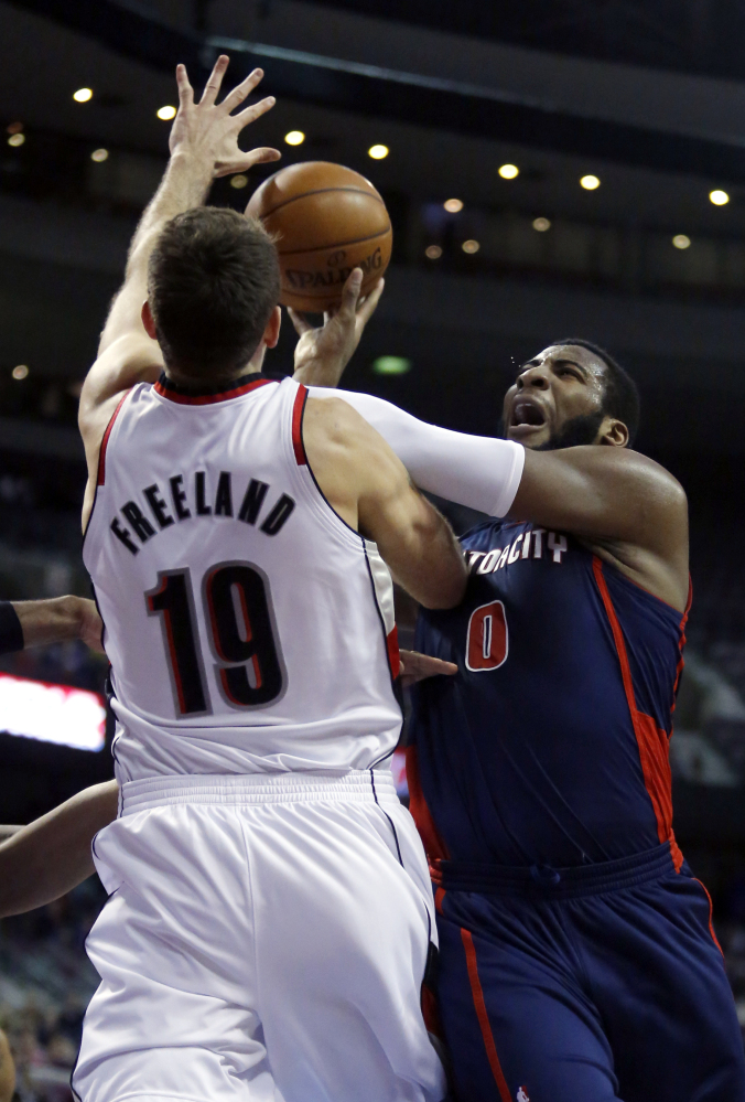 Detroit center Andre Drummond takes a shot against Portland center Joel Freeland during the first half of Sunday’s game at Detroit, a 111-109 win for the Trail Blazers.