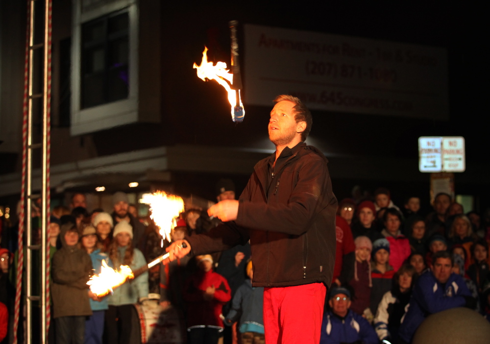 David Graham of the Red Trouser Show juggles fire in a performance Dec. 6 during the First Friday Art Walk in Portland.