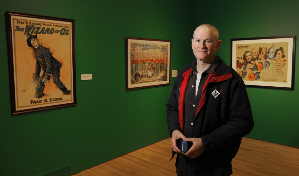 Willard Carroll of Camden poses for a portrait among "The Wonderful World of Oz: Selections from the Willard Carroll/Tom Wilhite Collection" at the Farnsworth Art Museum.