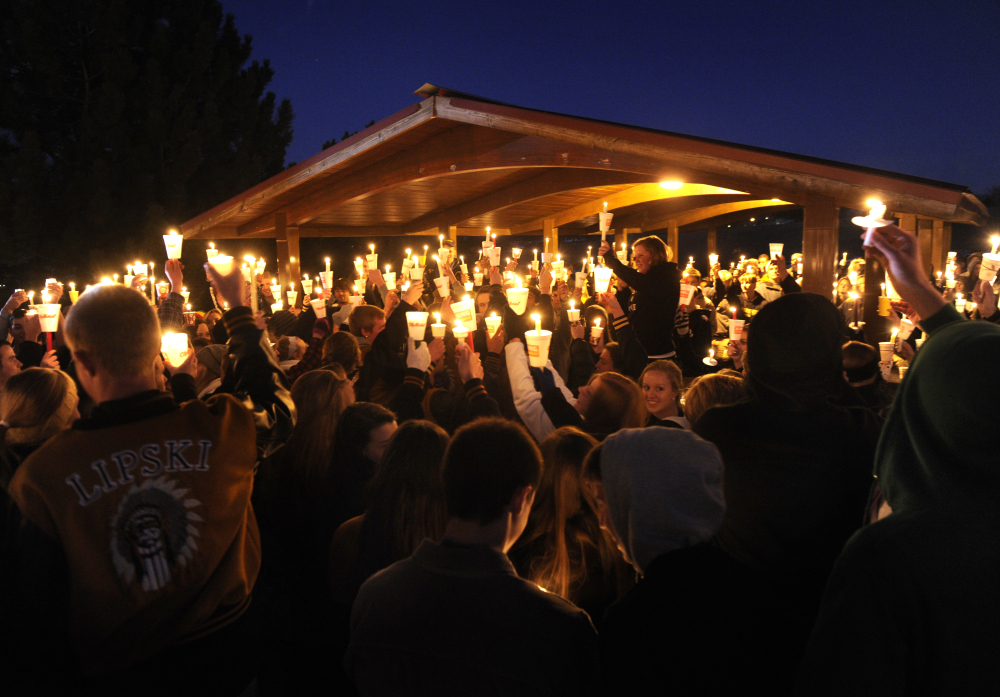 Hundreds of Arapahoe High School students gathered for a candlelight vigil Saturday night, Dec. 14, 2013, to share their prayers for Claire Davis who was shot inside the school Friday, Dec. 13, 2013. The vigil was held at Arapaho Park in Centennial, not far from the school.
