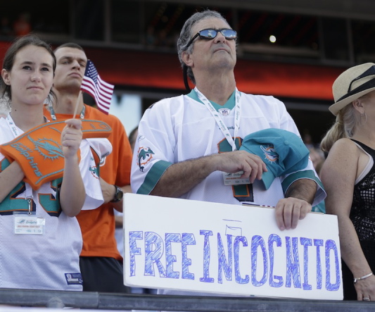 A fan shows his support for Miami Dolphins’ Richie Incognito before the start of the Nov. 17 game against the San Diego Chargers in Miami Gardens, Fla.