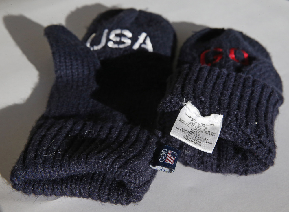 The U.S. Olympic Committee is selling embroidered mittens made in China to raise funds for U.S. athletes in the Winter Olympics.The committee is charging $14 a pair for the blue gloves that have the word “Go” embroidered in red on one mitten and “USA” on the other. The pair is also labeled with a tag on the inside which says the gloves are “Made in China.”