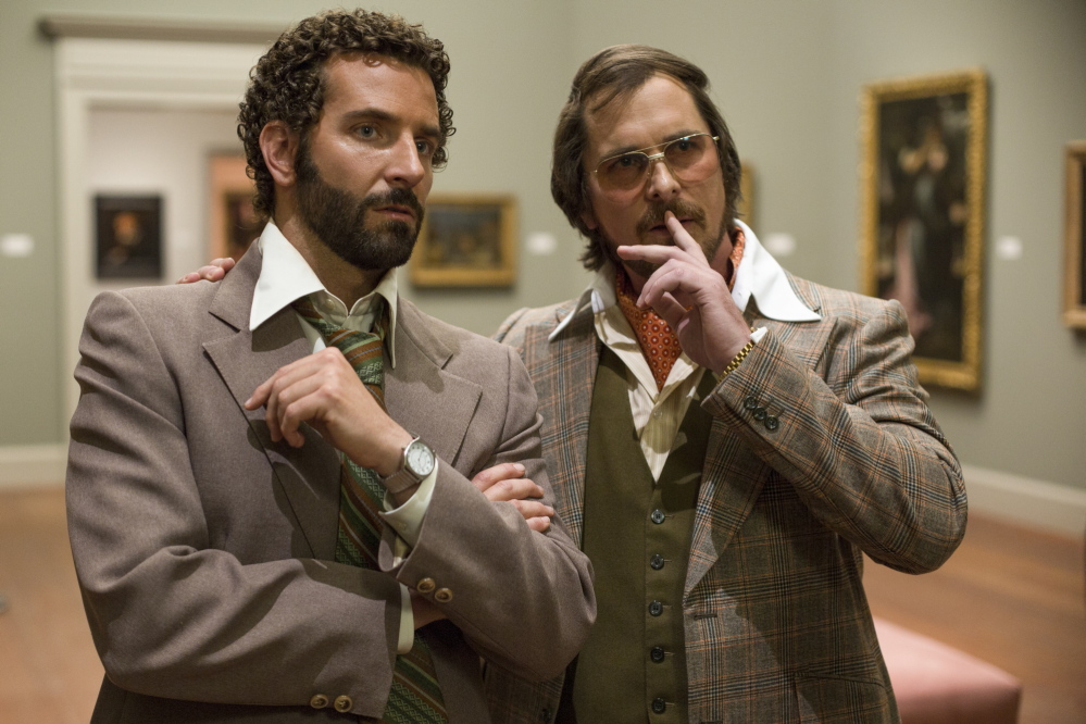 Bradley Cooper, left, and Christian Bale in “American Hustle.”