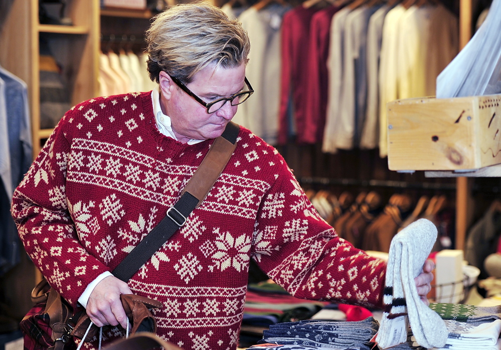 Steve Campbell of Portland shops for Christmas gifts at Portland Trading Co. on Middle Street.