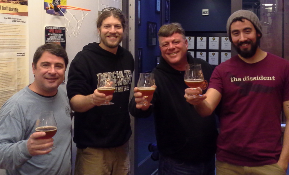 From left, Bill Stebbins, assistant brewer at Gritty McDuff’s; Ben Kehs, head brewer at Deschutes Brewing Company in Portland, Ore.; Ed Stebbins, brewmaster at Gritty’s; and Jason Barbee, assistant brewer at Deschutes, during a recent visit by the Gritty’s team to the Deschutes facility.