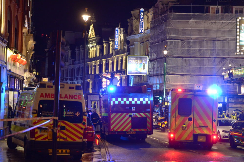 Emergency services attend the scene at the Apollo Theatre in central London.