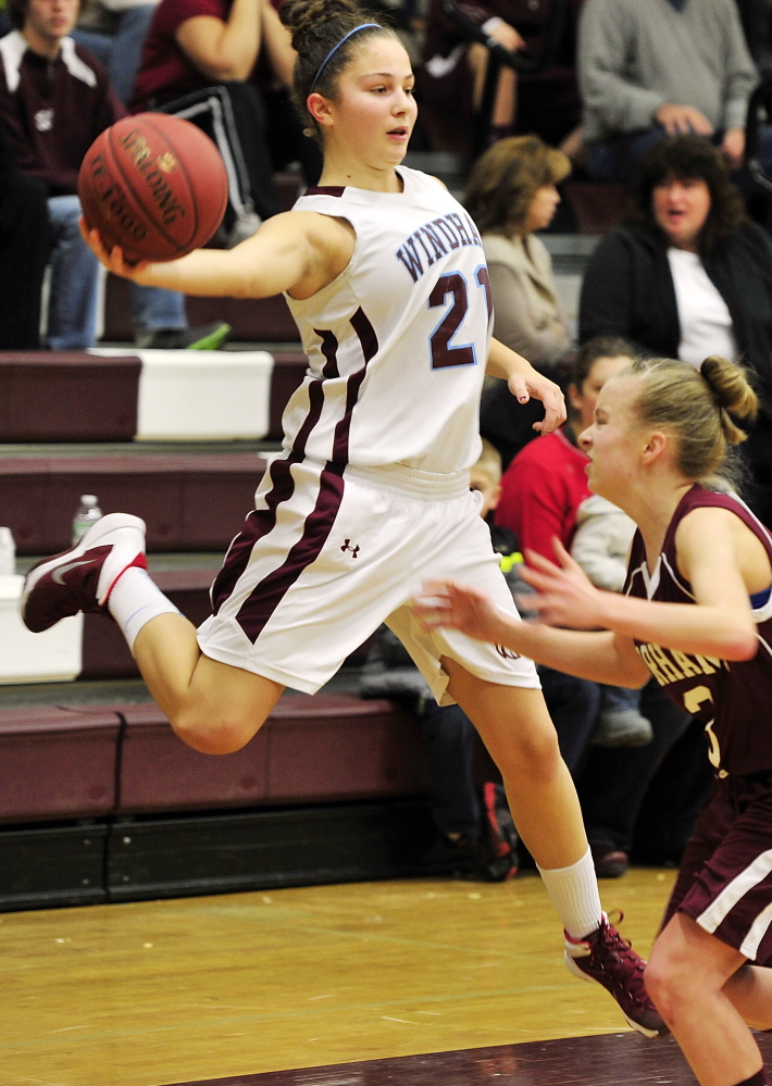 Luisa Sbardella of Windham reaches out to stop the ball from going out of bounds as Gorham’s Kaylea Lundin defends.