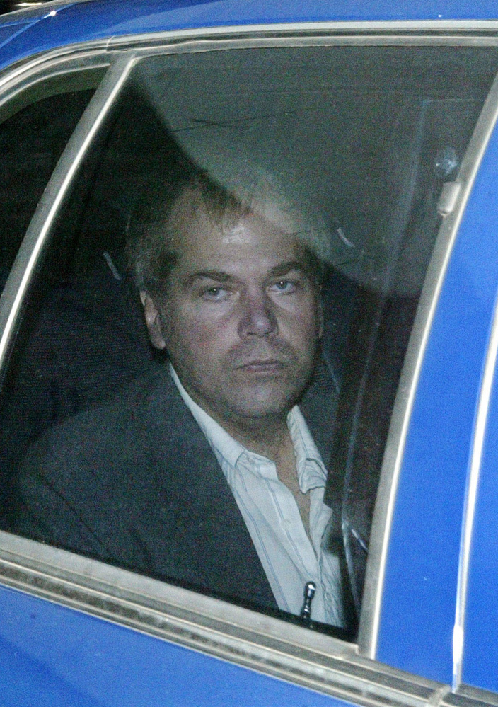 John Hinckley Jr. arrives at U.S. District Court in Washington on Nov. 18, 2003. A judge has ruled that the man who attempted to assassinate President Ronald Reagan will get to spend more time outside a mental hospital where he has been confined for most of the past three decades.