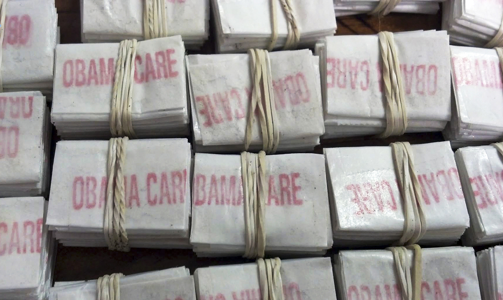 Packets of heroin labeled “Obamacare” and “Kurt Cobain,” which troopers confiscated in Hatfield, Mass., are shown in a photo released by Massachusetts State Police on Friday.