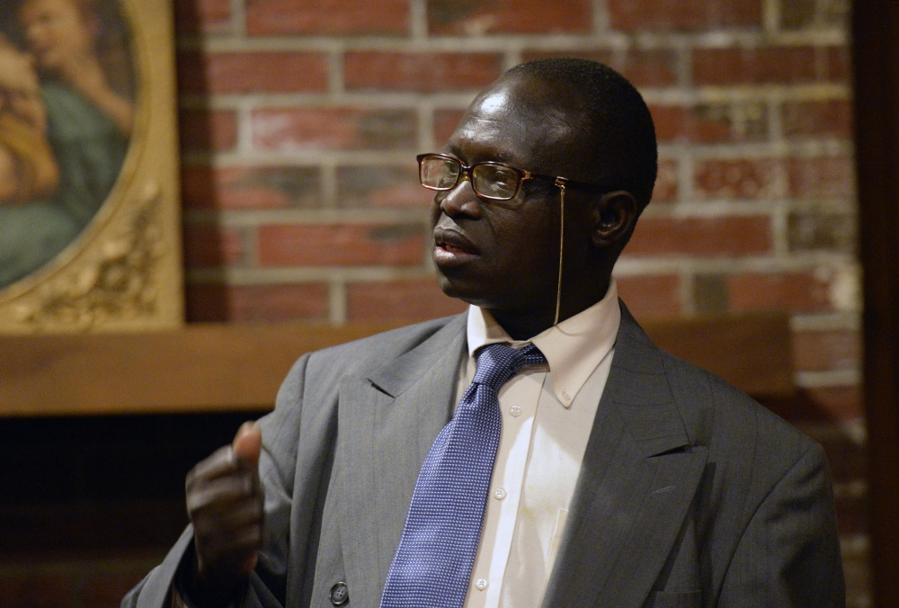 Edward Laboke of Portland, a Sudanese immigrant, speaks about the violence in South Sudan during a meeting at Trinity Episcopal Church in Portland on Saturday.