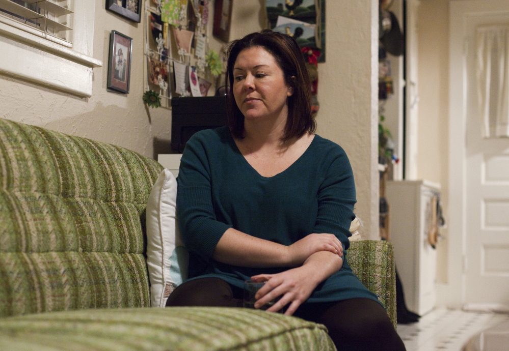 April Capil, a breast cancer survivor, sits in her home in Boulder, Colo., on Dec. 3. Capil, who is suing health insurance provider HealthMarkets for $230,000 in unpaid medical bills, said she worries that many people falsely believe their policies are comprehensive.