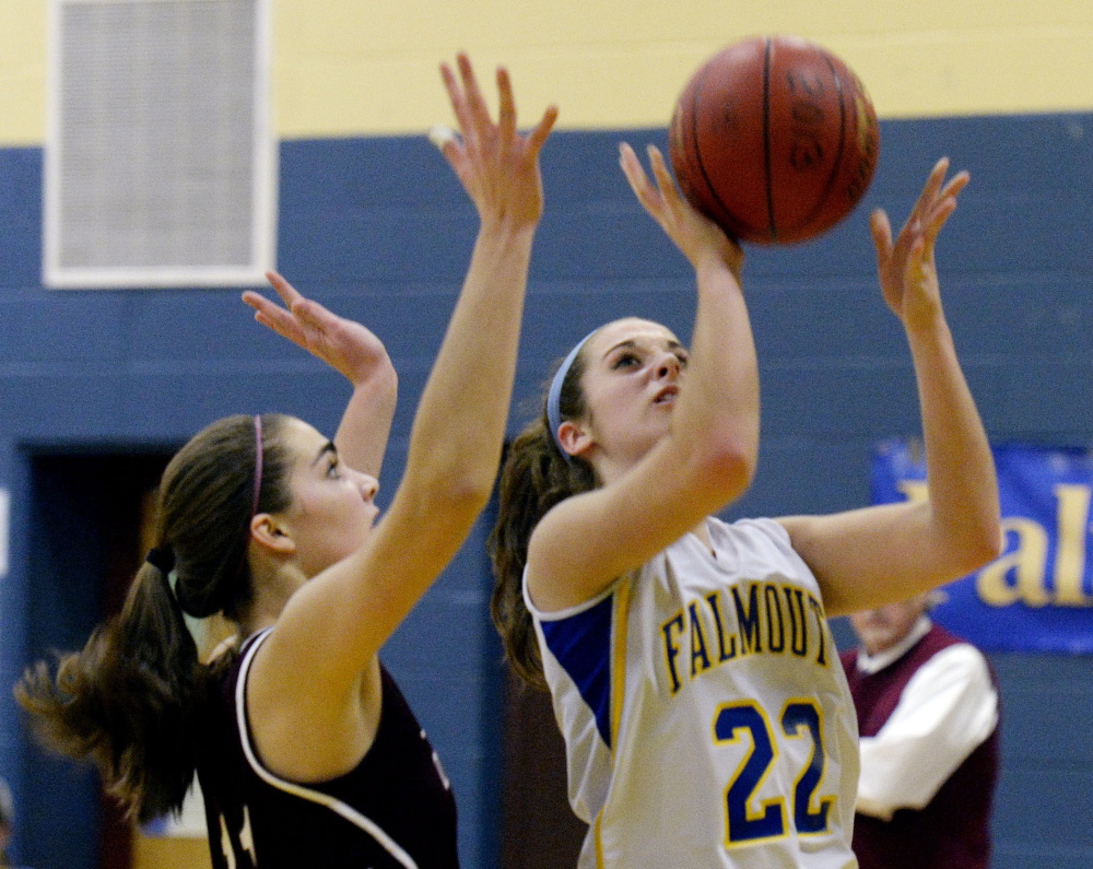 Ally Hickey of Falmouth drives to the basket against Greely’s Ashley Storey. Hickey paced the Yachtsmen with 19 points, including four 3-pointers.