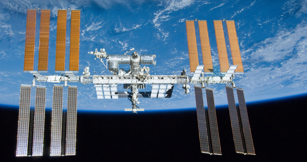 The space station orbits Earth. The breakdown of a pump had forced the astronauts to turn off all nonessential equipment inside the lab, leaving the station in a vulnerable state.