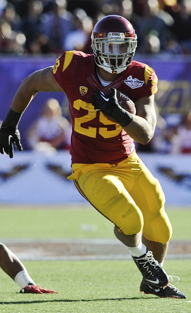 Ty Isaac of Southern Cal runs Saturday afternoon during the Trojans’ 45-20 victory against Fresno State in the Las Vegas Bowl.