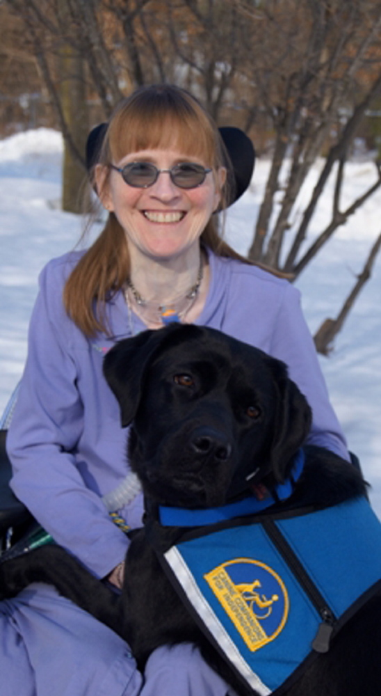 Brenda Weeks of Auburn poses with Buffy, a Canine Companions for Independence service dog that she was paired with in February. The organization provides assistance dogs to children and adults with disabilities at no cost to the recipient.