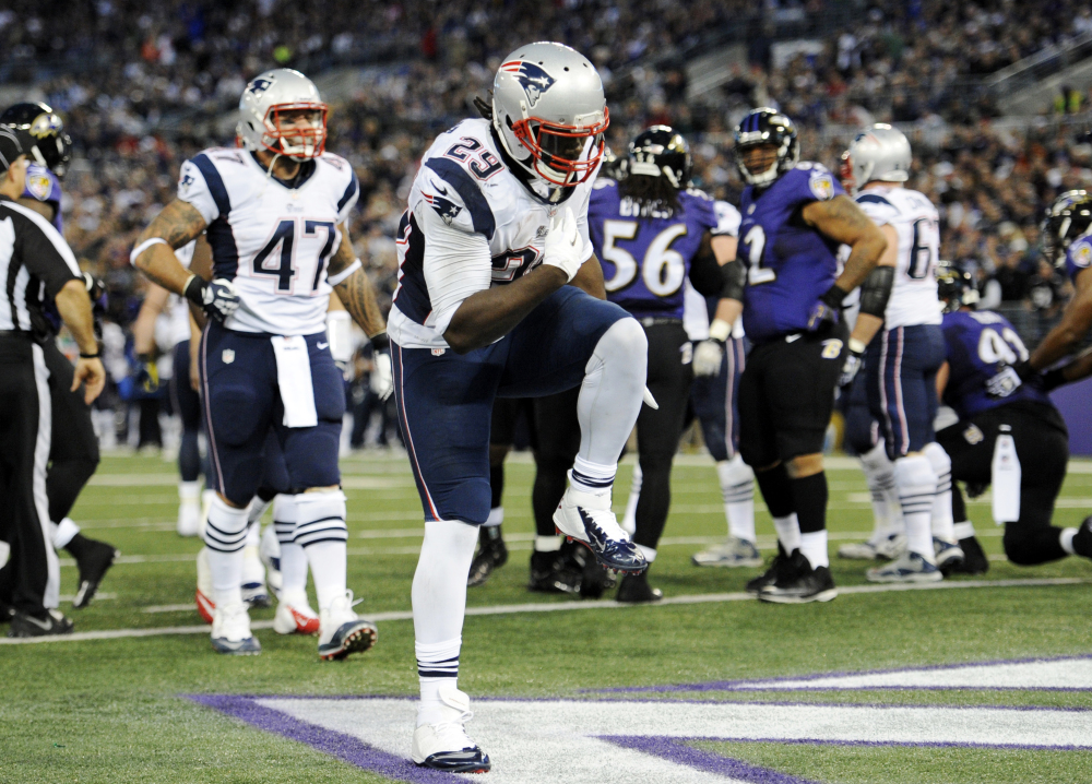 New England Patriots running back LeGarrette Blount (29) celebrates after scoring a touchdown in the first half against the Baltimore Ravens on Sunday.