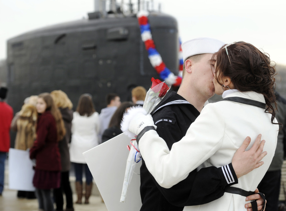 Newlyweds Electronic Technician 2nd class Tyler and Leigh Schneider embrace on the pier as the U.S. Navy attack submarine USS Missouri returns to the submarine base in Groton, Conn., after completing a six-month overseas deployment Friday. The attack submarine, one of the most advanced in the Navy fleet, conducted missions involving surveillance and reconnaissance in an area of operations around Europe on its maiden deployment.