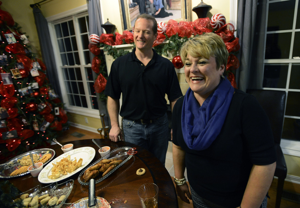 Dr. Jason Cabler and his wife, Angie, get ready for a holiday party at their home in Hendersonville, Tenn. Cabler, 46, suffered a heart attack on Christmas Day in 2012 while lifting weights in the exercise room in their home. Studies indicate heart troubles, including fatal heart attacks, spike this time of year, especially on Christmas and New Year's.