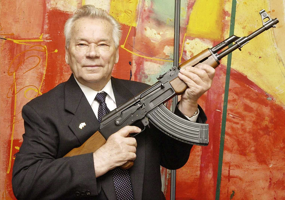 Russian weapons designer Mikhail Kalashnikov presents his legendary assault rifle to the media while opening the exhibition “Kalashnikov - legend and curse of a weapon” at a weapons museum in Suhl, Germany, in this 2002 photo.